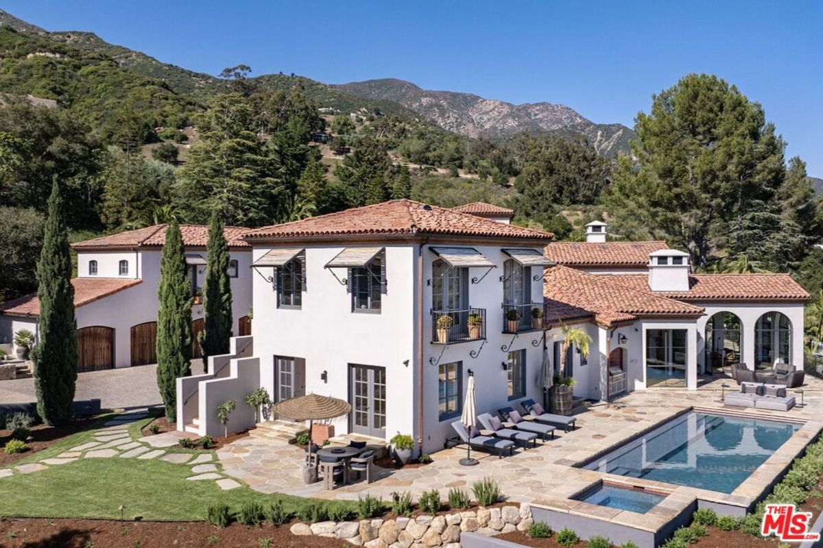 Poolside area framed by majestic mountain views.