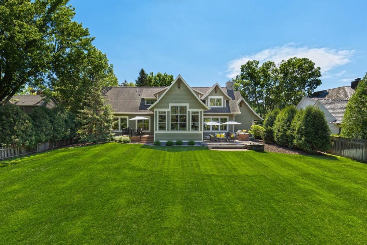 Expansive backyard offers a picturesque view of the home's stunning architectural design.