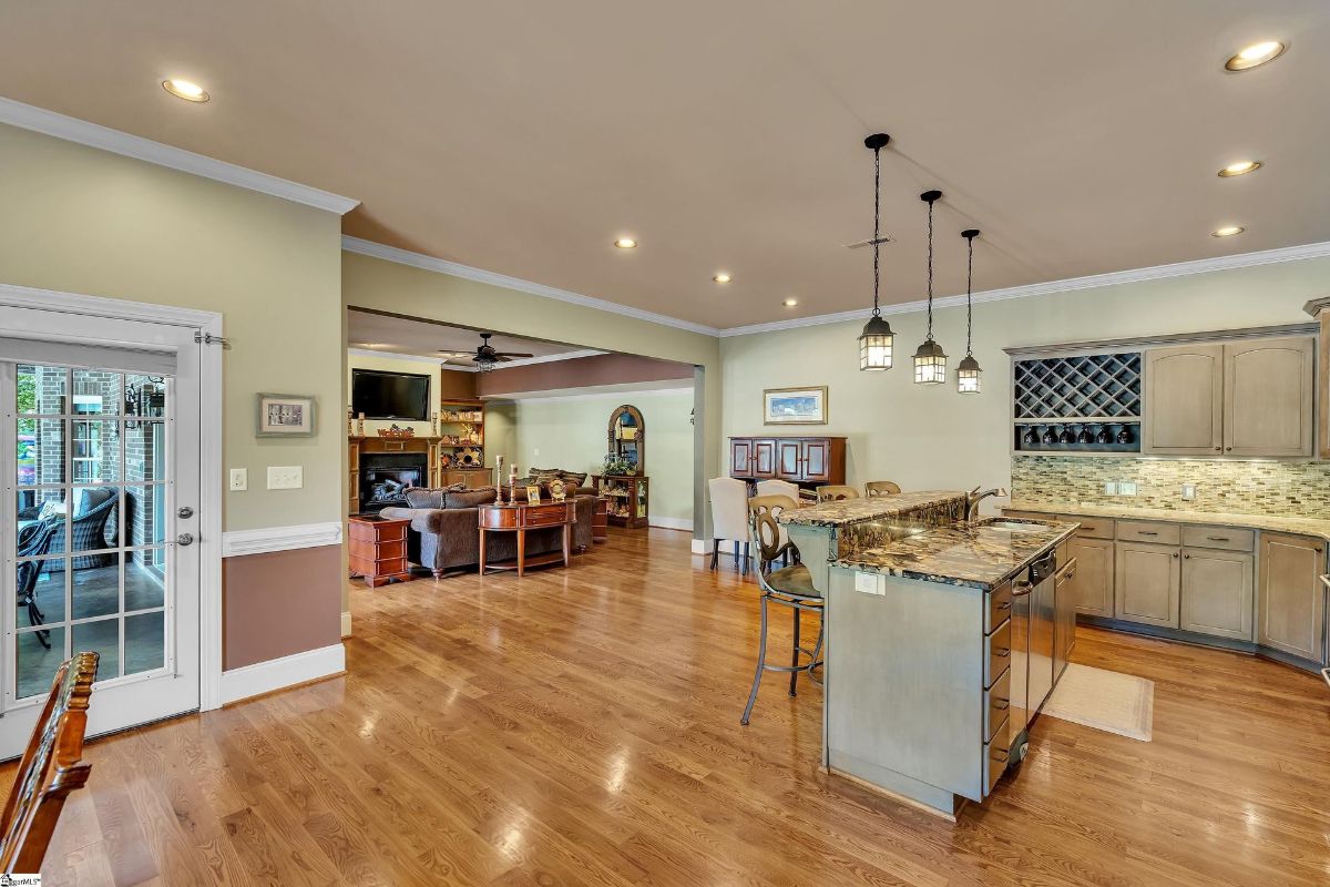 Open space seamlessly connects the secondary kitchen to the living and dining areas, ideal for casual entertaining and family gatherings.