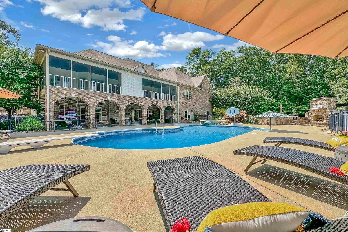 Sparkling pool surrounded by lounge chairs 