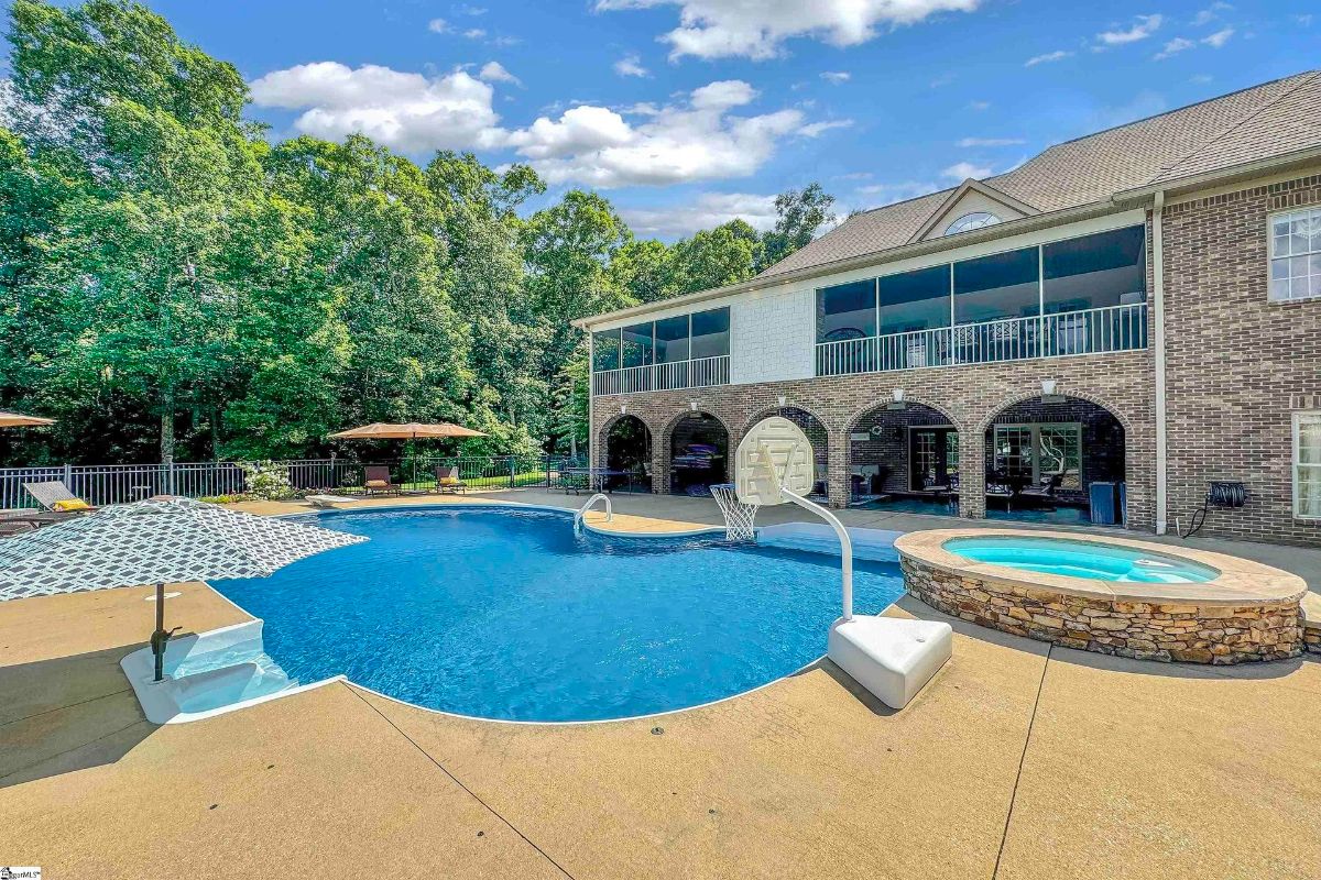 A sparkling pool with a basketball hoop.