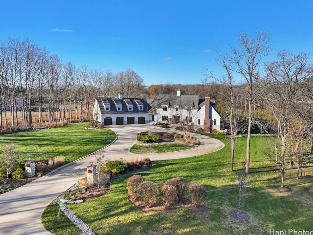 Mansion has a large garage attached to it.