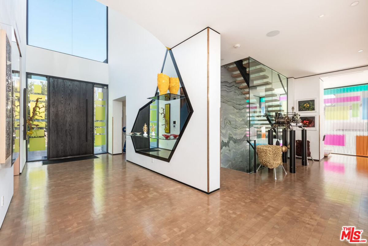 Geometric design elements highlight a dramatic entryway in this contemporary home.