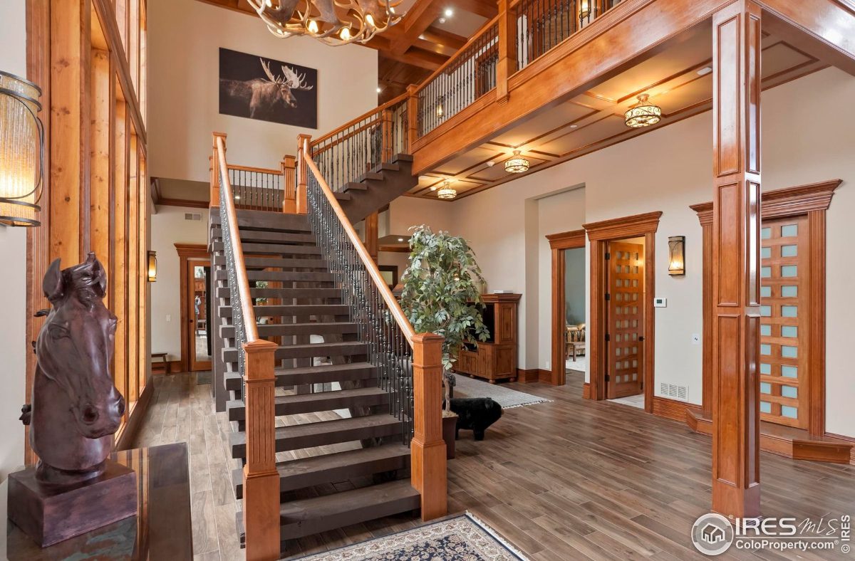 Grand staircase is a focal point of the home's interior, showcasing a dramatic design and high ceilings.