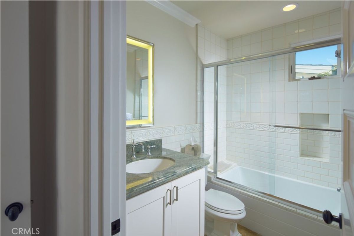 A bathroom with a shower and a bathtub.