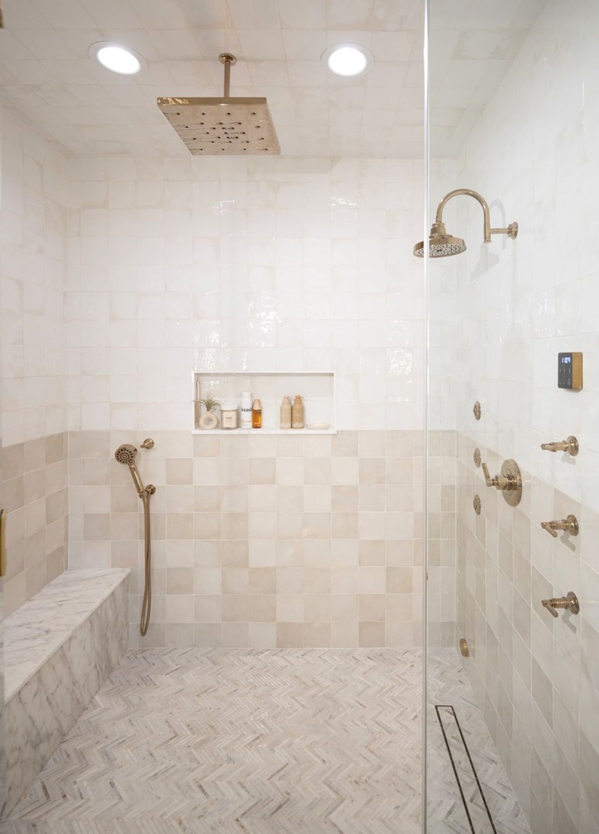 This expansive shower boasts a wealth of features designed for ultimate comfort and relaxation. From the large rainfall showerhead to the built-in bench and multiple body sprays, this shower is a luxurious retreat.