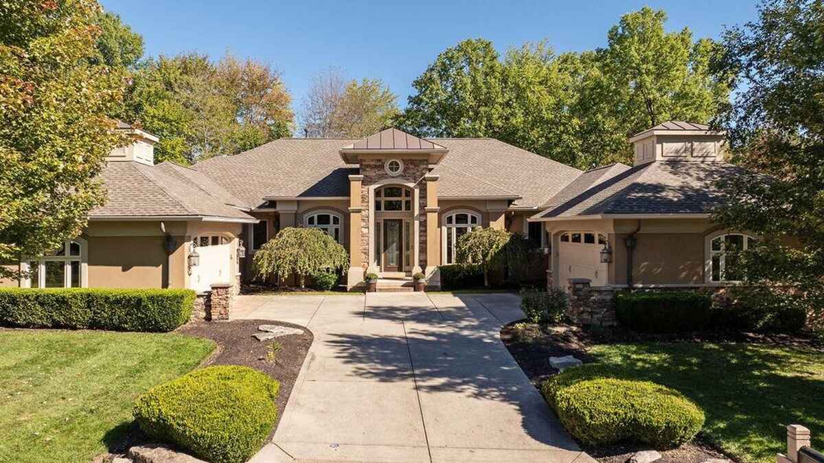 Closer view of the entrance emphasizes the architectural details, including stone columns and a grand doorway.