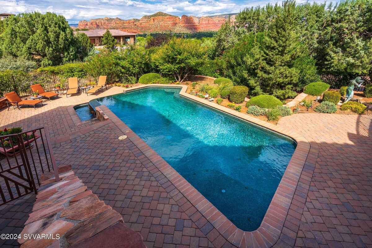 A top-down view of the pool and surrounding area, highlighting red rock views in the background.