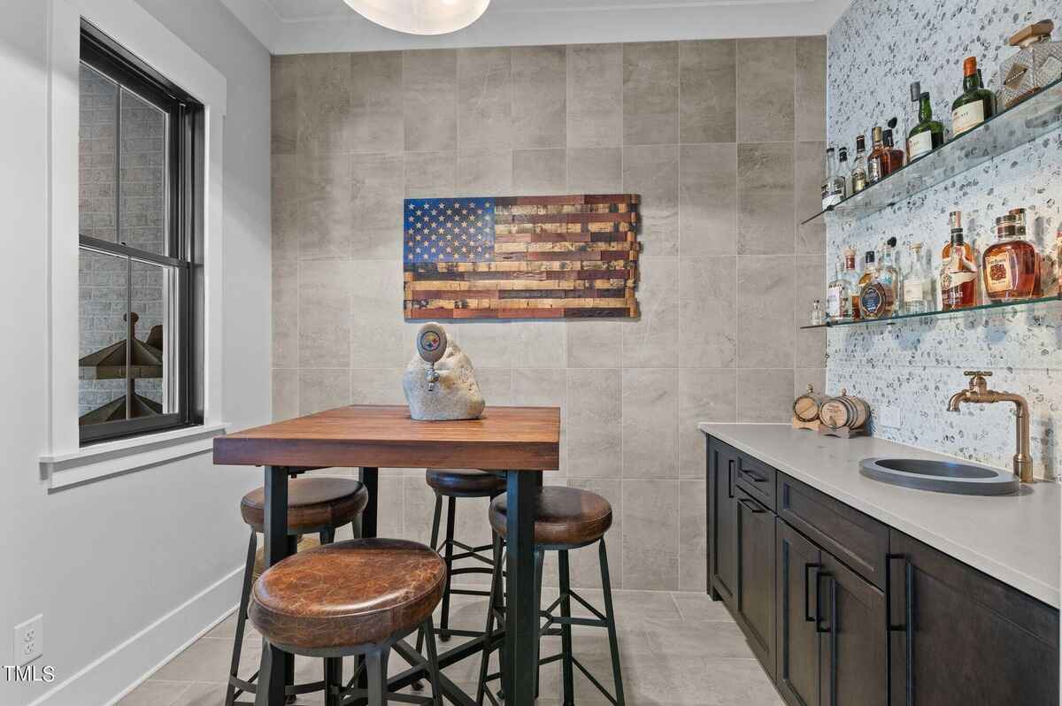 Cozy room with bar seating, textured walls, and wooden furniture.