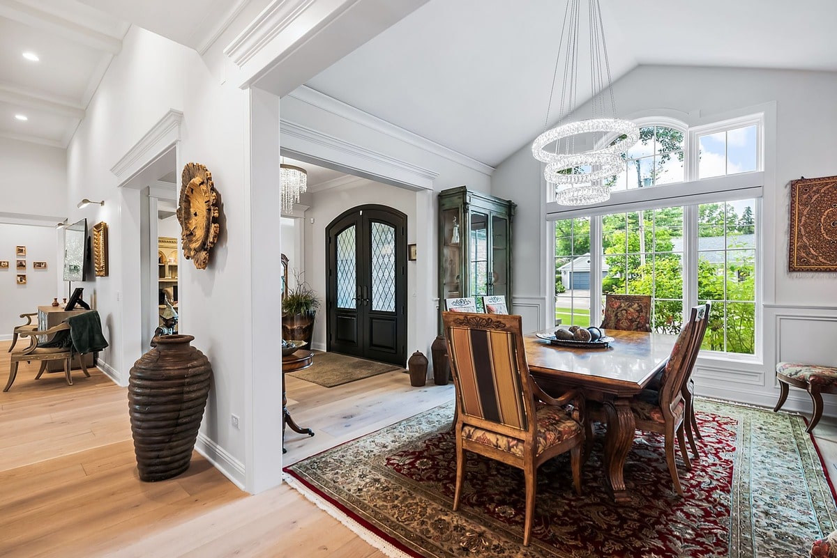 This open-concept living space, bathed in natural light, showcases a seamless flow between the living room and kitchen. 