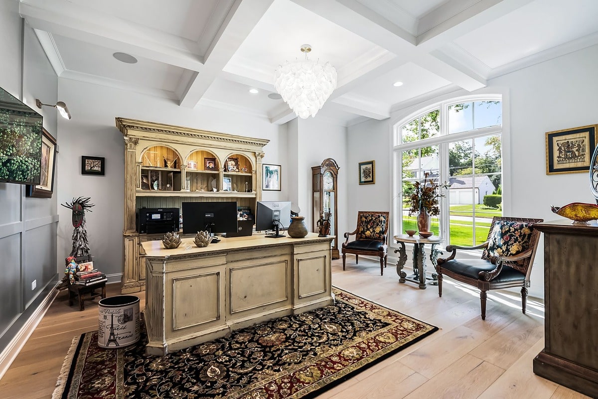 This expansive home office, bathed in natural light, offers a sanctuary of productivity. 