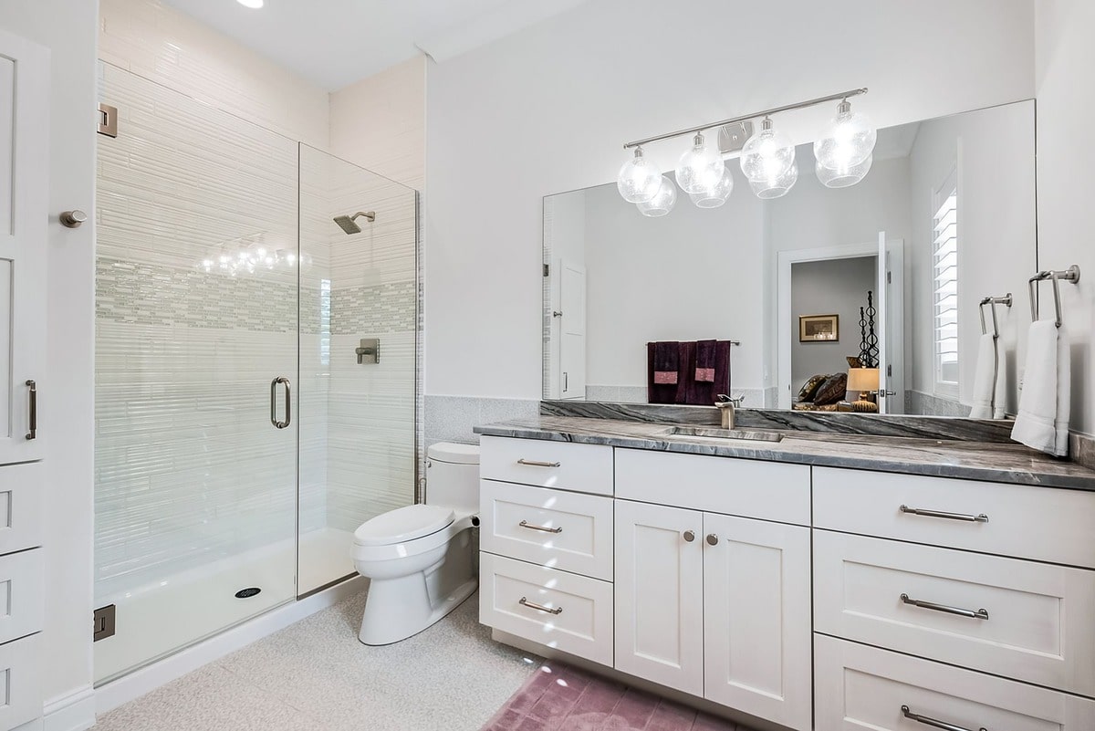 This spa-like bathroom, captured from a wide-angle perspective, exudes an air of sophisticated elegance. 