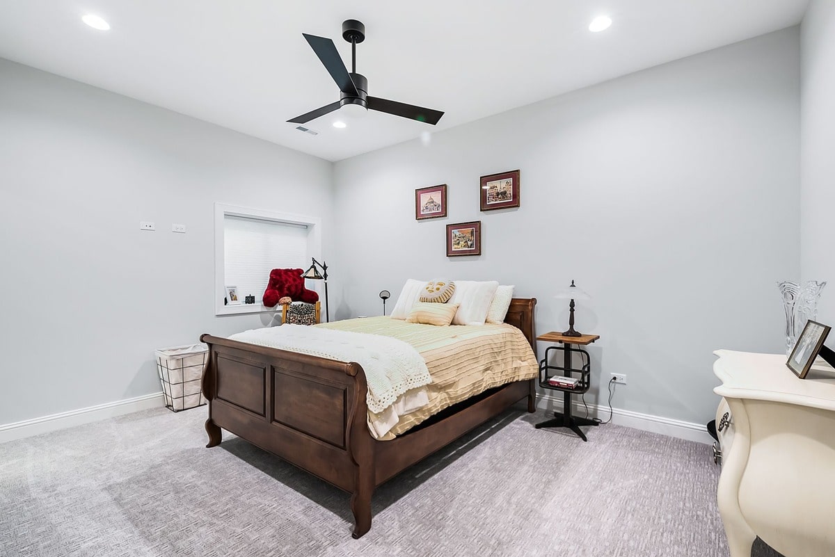 This inviting bedroom, captured from a wide-angle perspective, exudes a sense of comfort and tranquility.