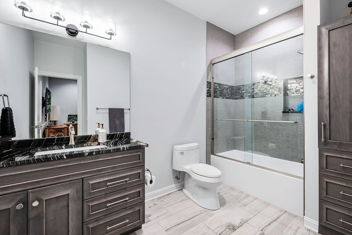 This spa-like bathroom, captured from a wide-angle perspective, exudes an air of sophisticated elegance. 