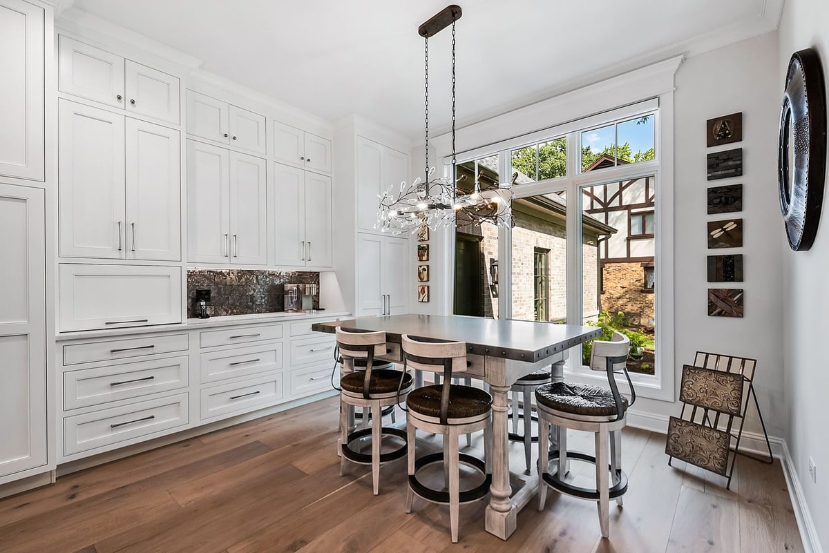 A glimpse into the kitchen reveals a well-appointed breakfast nook, perfect for morning coffee or casual meals.