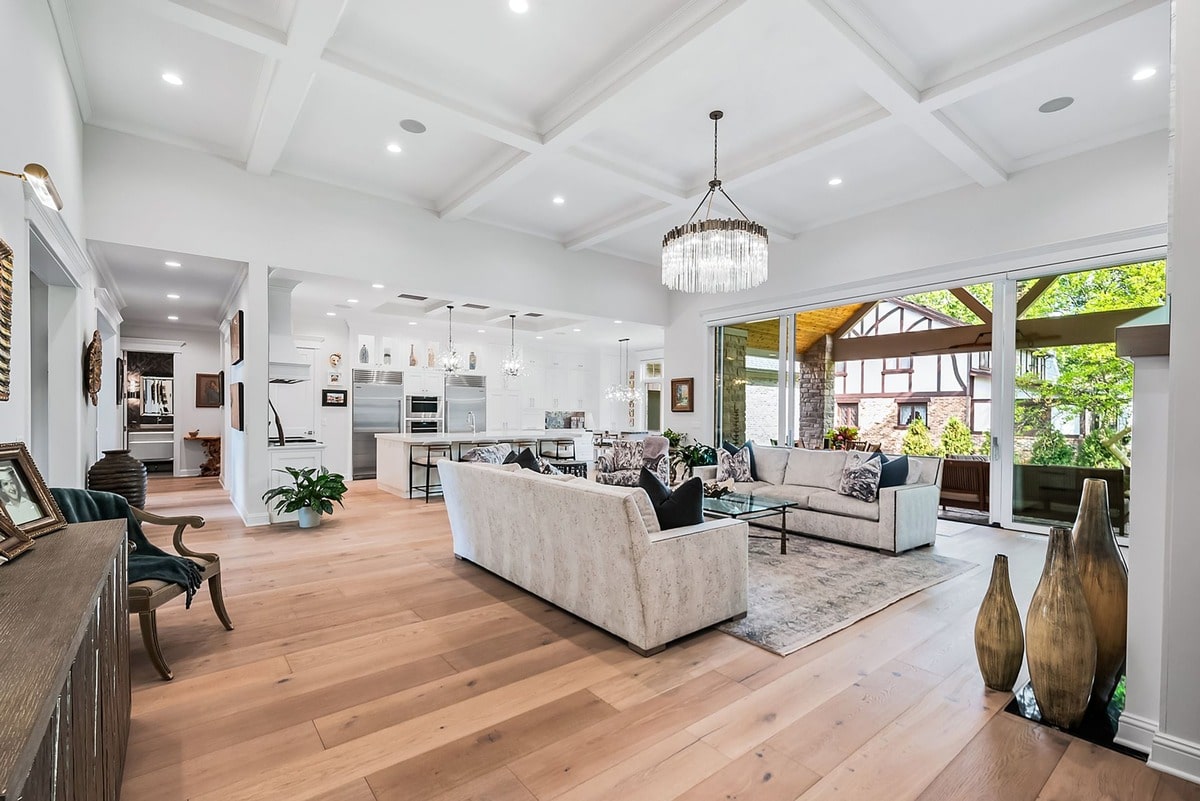 This expansive living room, captured from a wide-angle perspective, exudes an air of sophisticated elegance. 