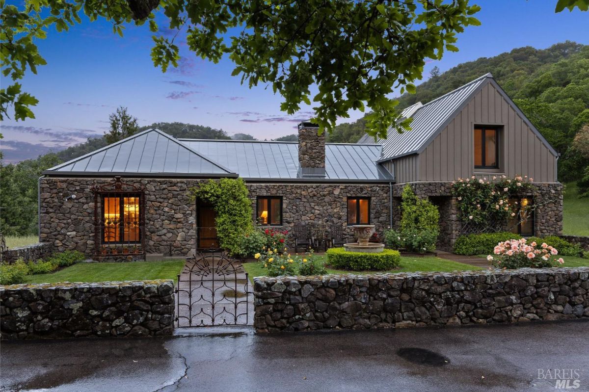 Twilight view of the home emphasizing its inviting facade, landscaping details, and tranquil atmosphere.