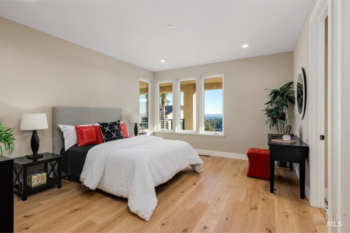 Stylish bedroom with a modern design and large windows for abundant natural light.