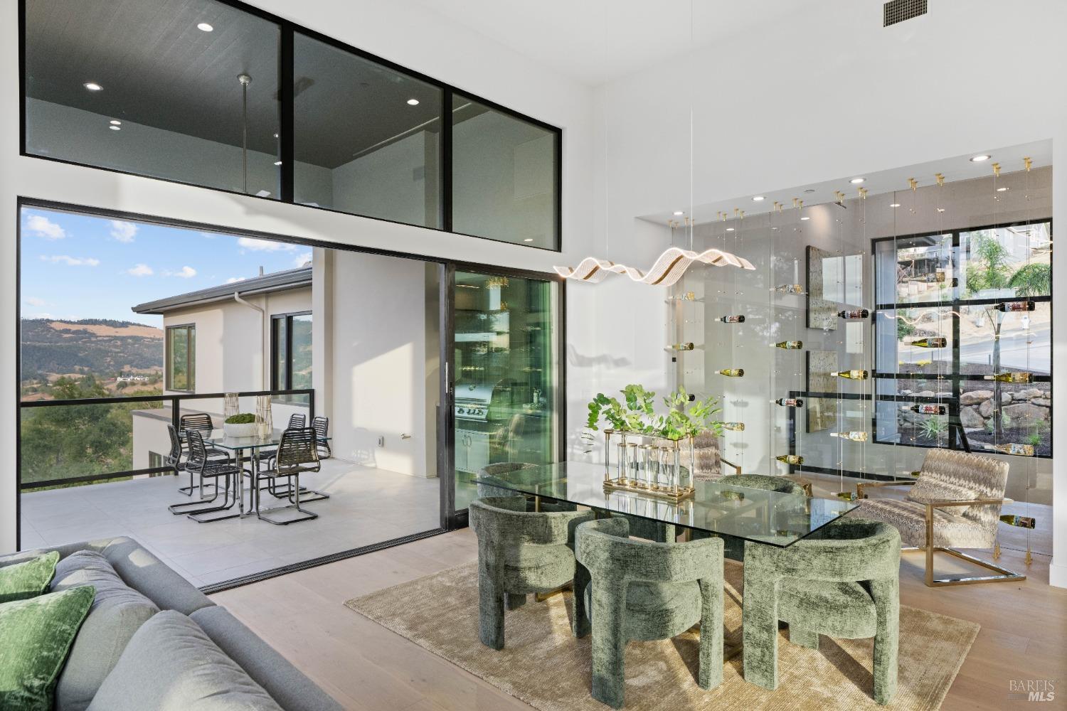 Open dining area with large sliding doors leading to an outdoor seating area.