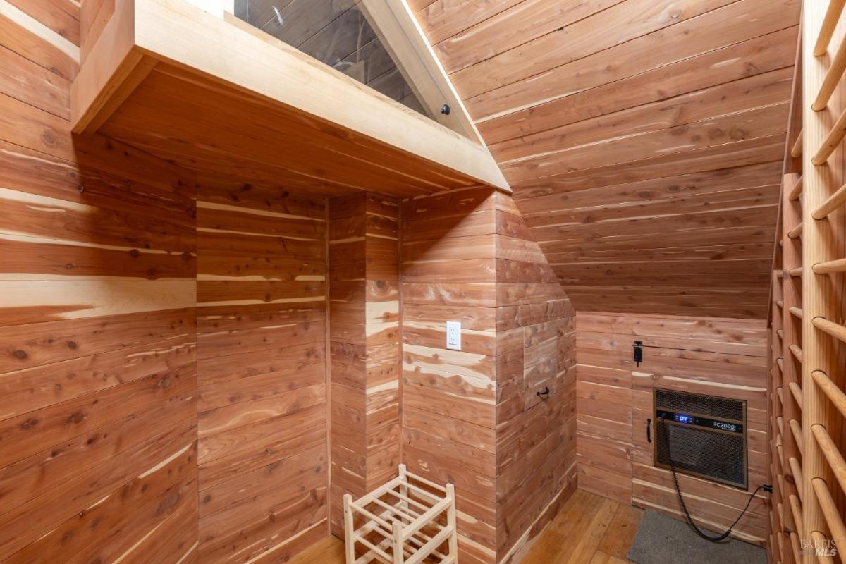 A cedar-lined wine cellar with shelving and storage space.