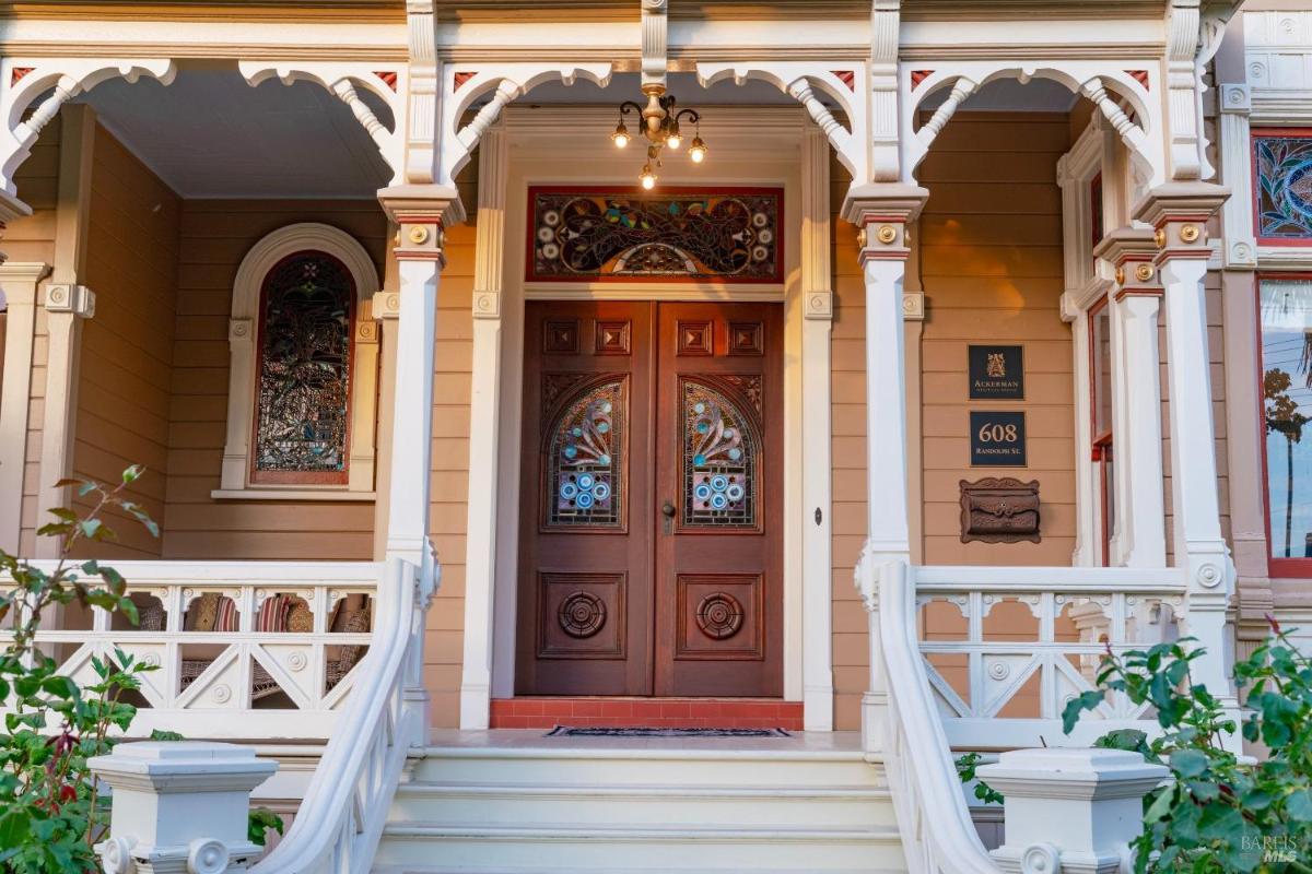 Close-up of a double-door entryway with stained glass details.