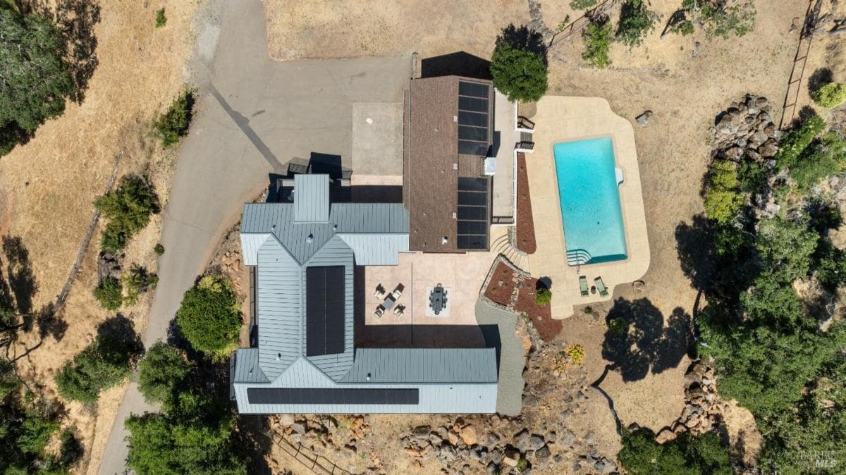 Overhead view of the house, pool, and patio layout.