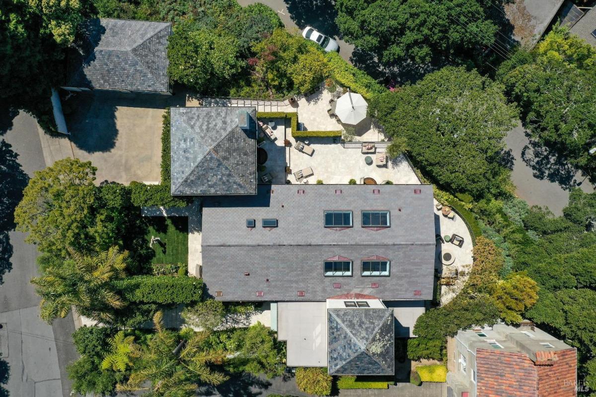 Overhead view of the house layout, outdoor terraces, and nearby structures.