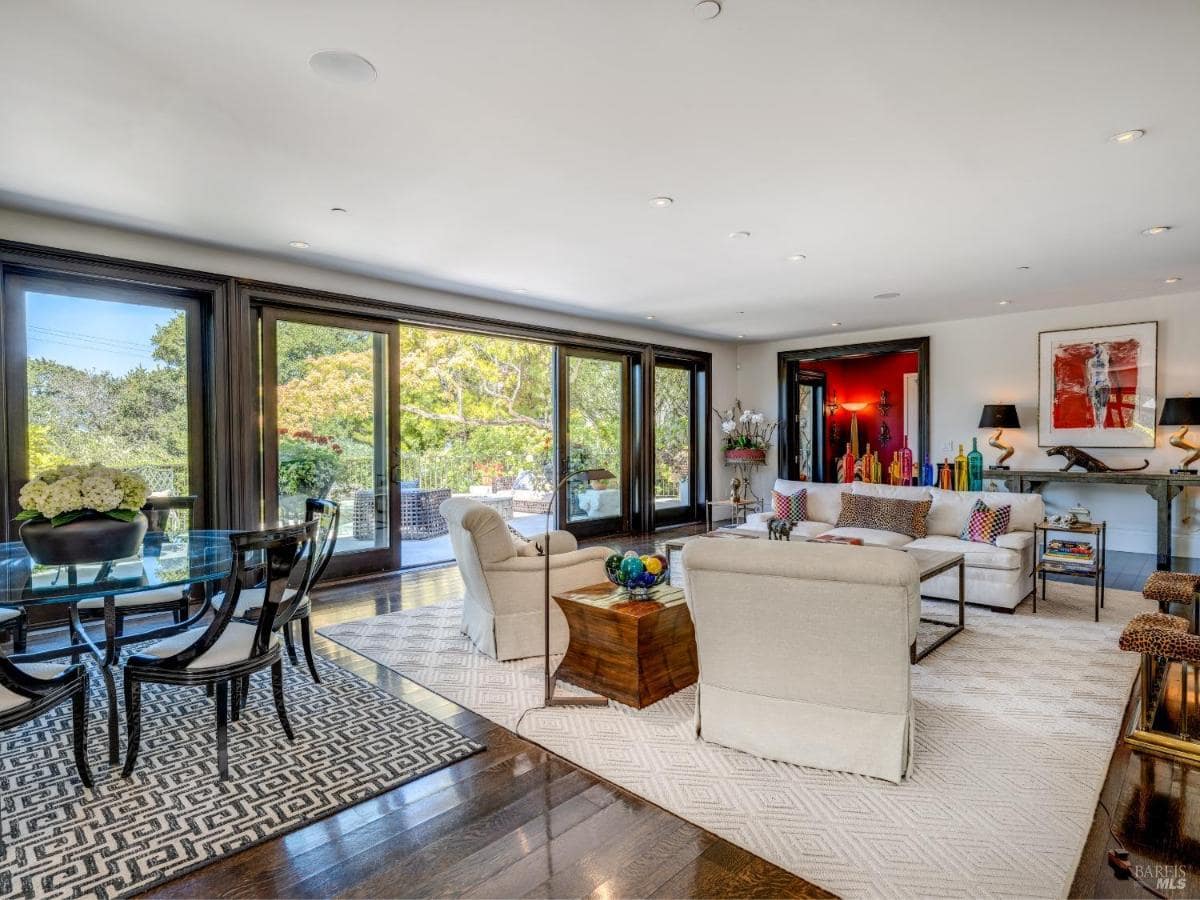 Living and dining area with sliding glass doors to the backyard.