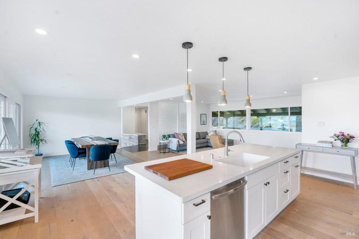 Open kitchen and dining area with natural lighting.