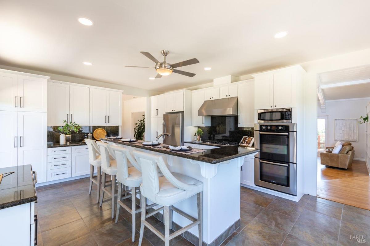 A kitchen with sliding doors leading to a patio area.