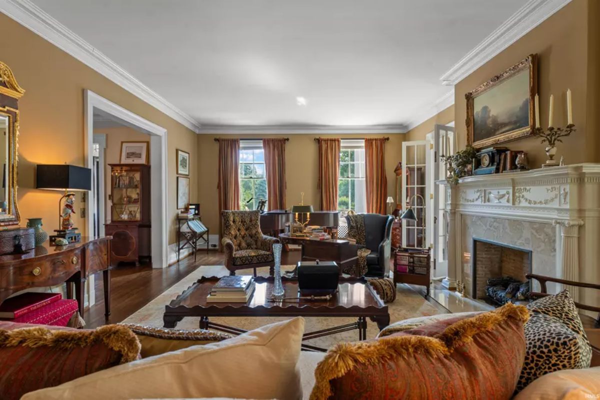 Formal living room featuring a decorative mantel and fireplace as the central focal point.