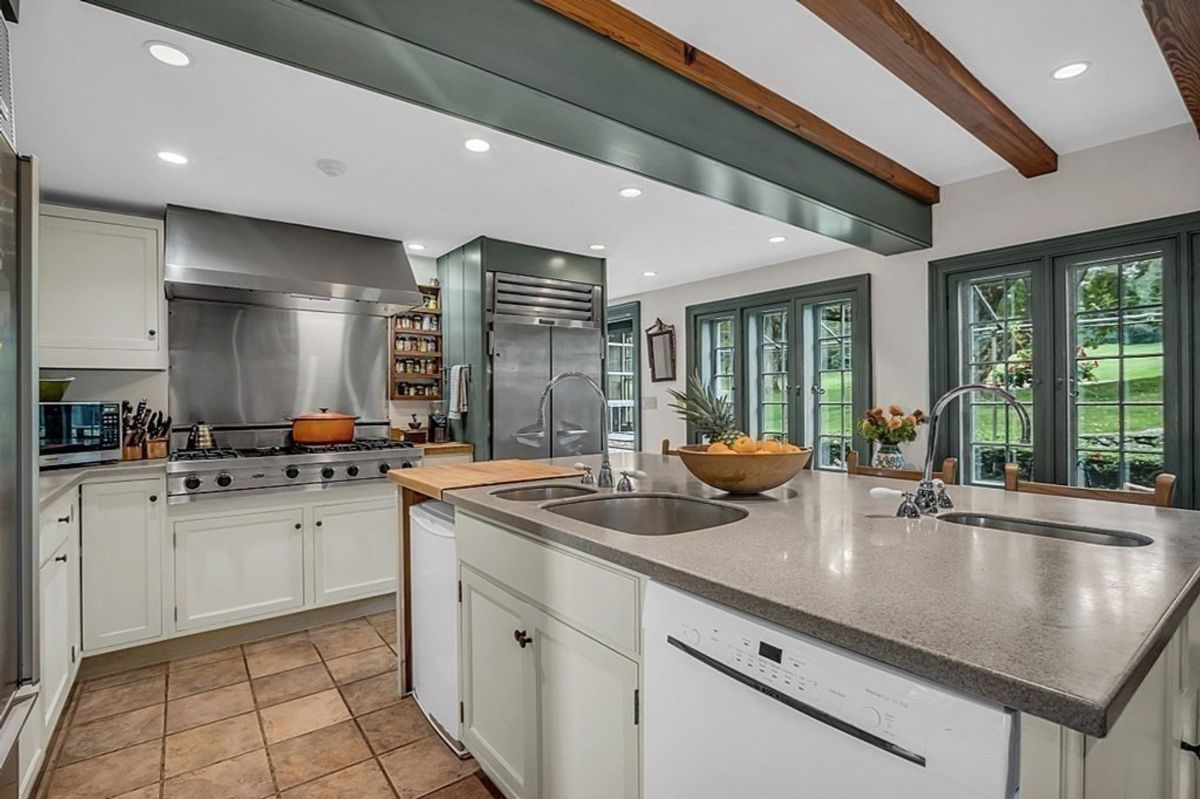 Gourmet kitchen with professional-grade appliances and expansive counter space.