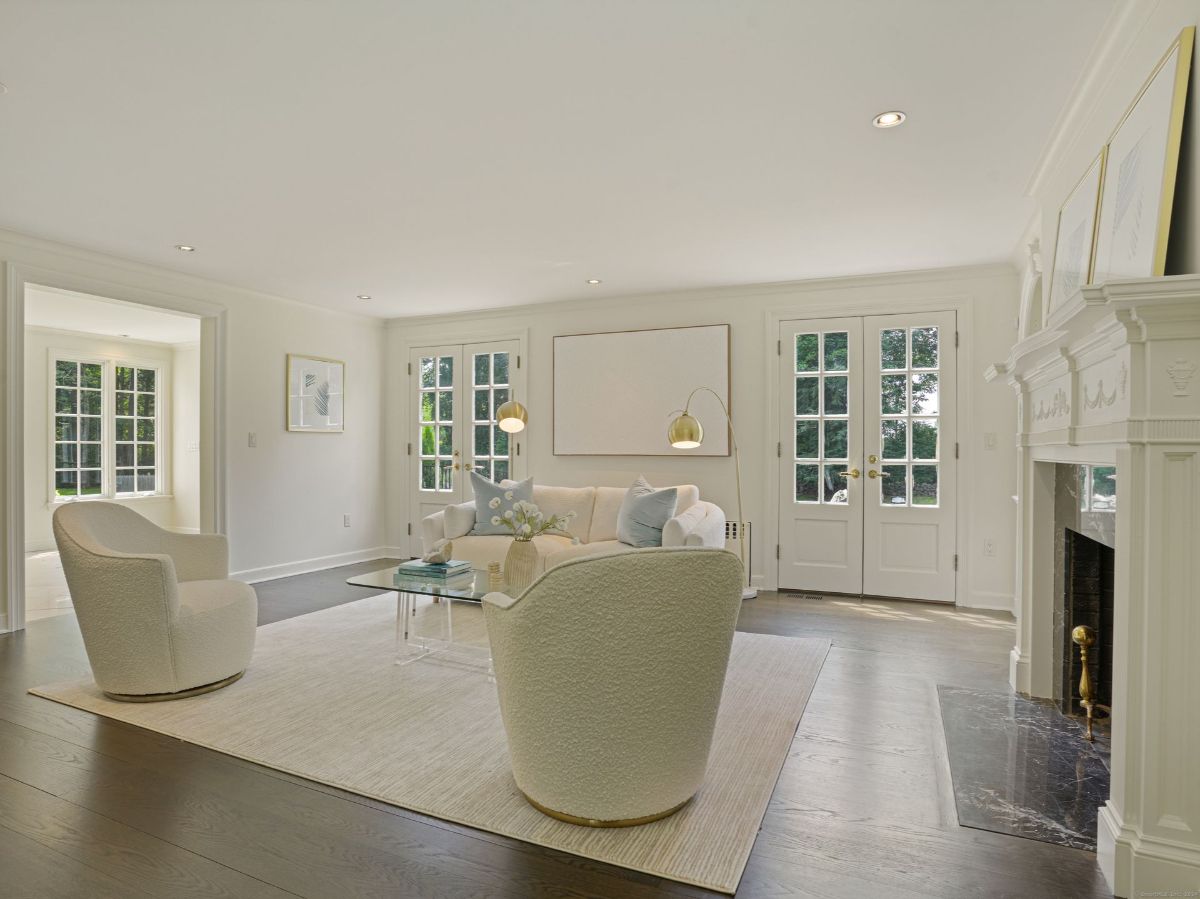 Living room with fireplace and French doors.