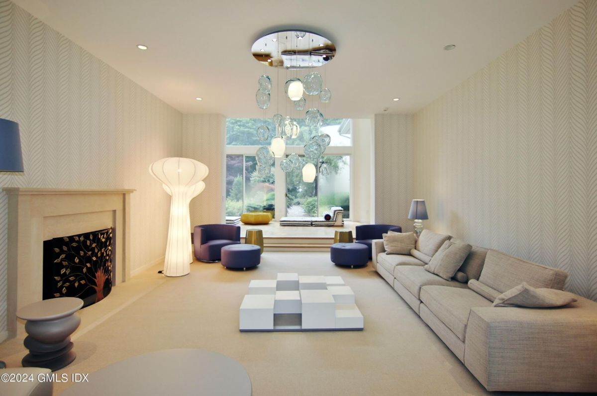 Elegant modern design pairs neutral tones with artistic lighting, creating a serene and inviting living space.