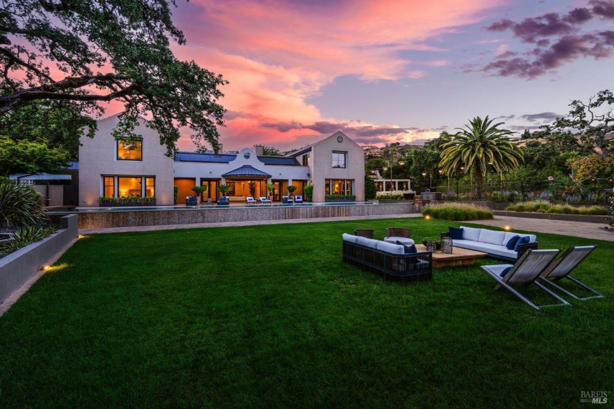 Sunset views enhance the charm of this estate with expansive outdoor entertaining areas.