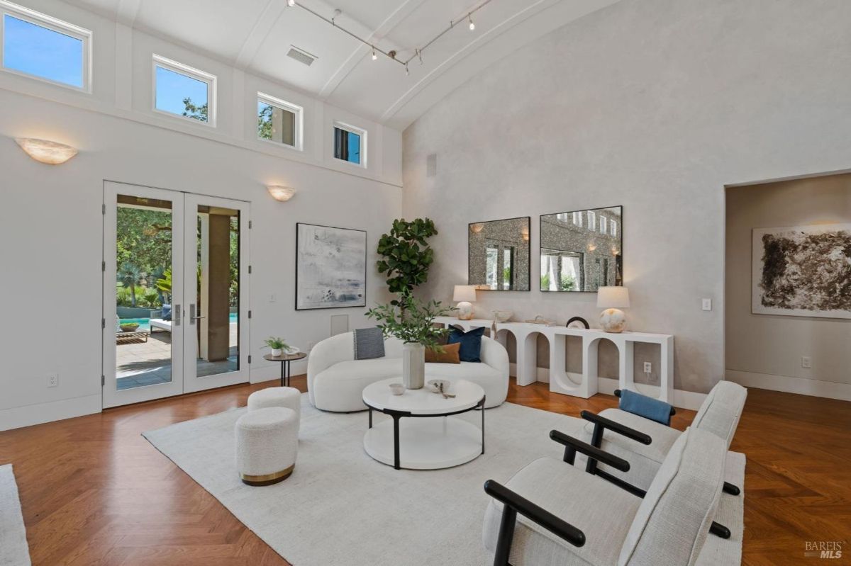 Elegant seating area with natural light, minimalist decor, and a cozy ambiance.