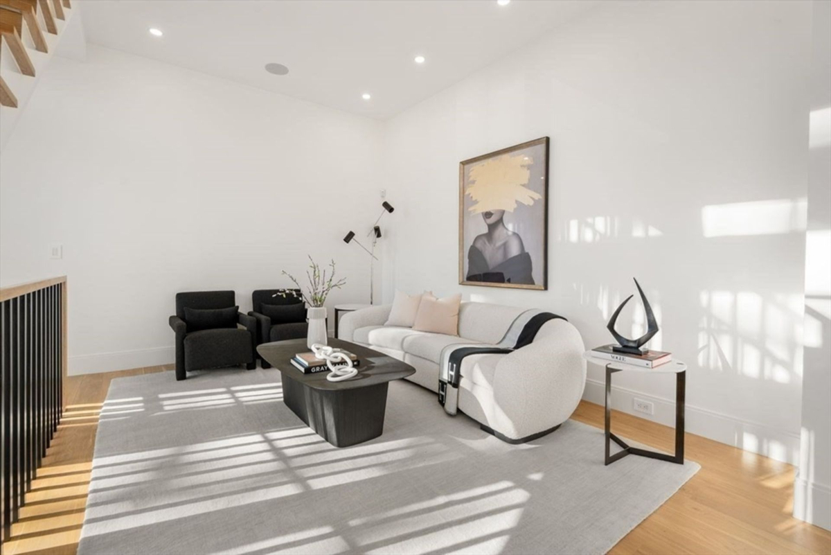 Cozy lounge area with a contemporary white sofa and minimalist decor.