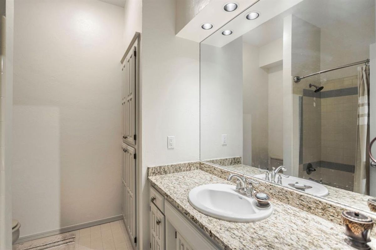 Modern bathroom featuring a granite countertop