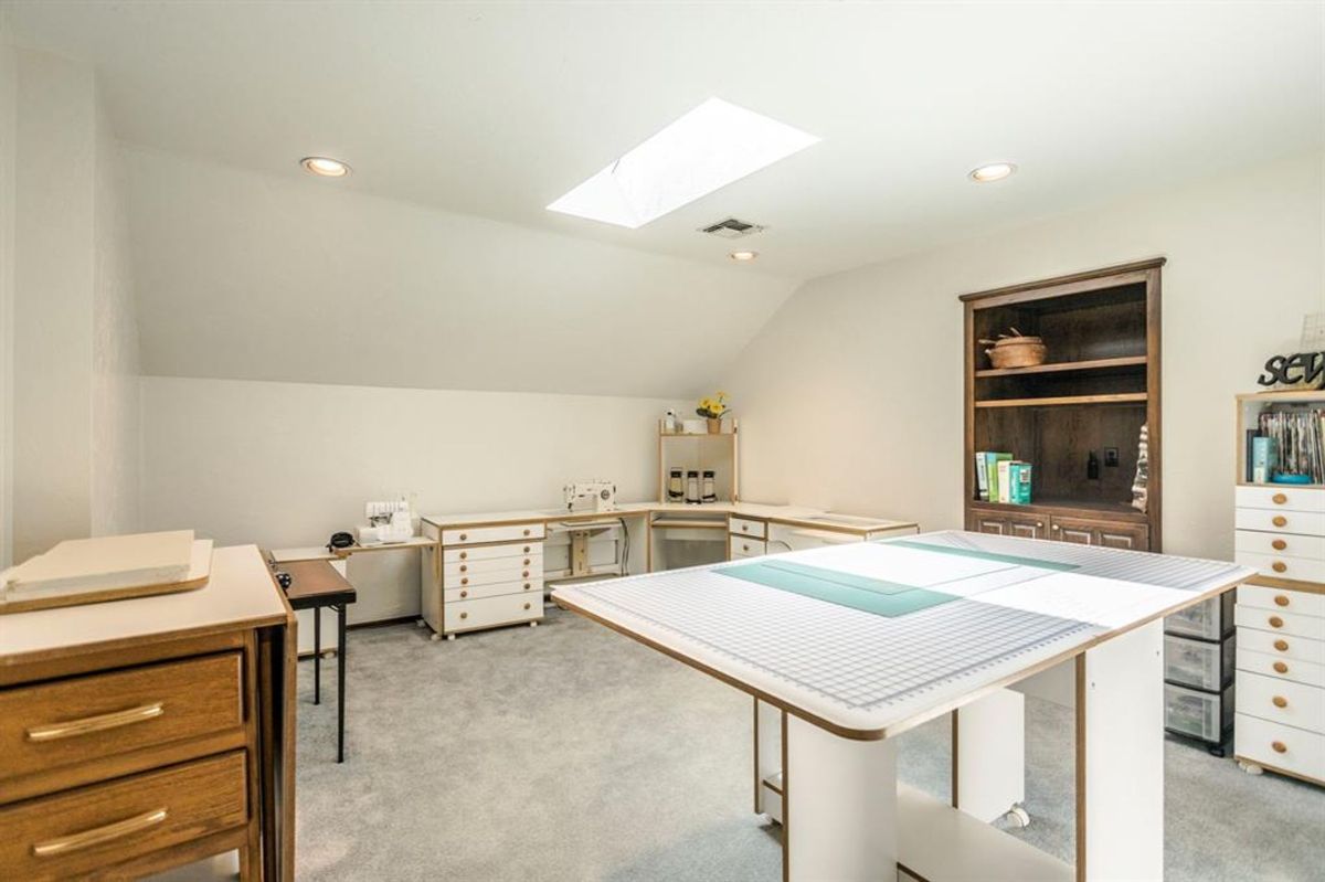 Bright craft room with built-in cabinetry.