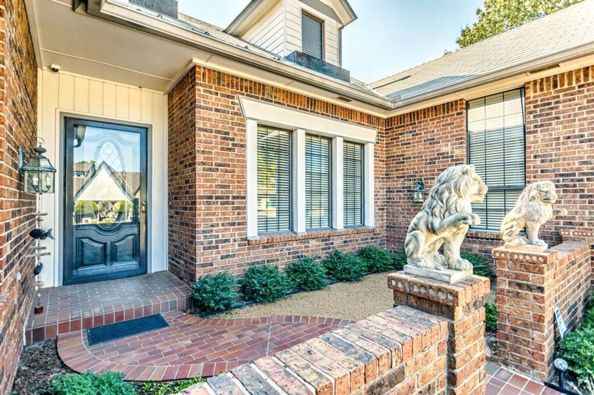 Entryway with decorative lion statues.