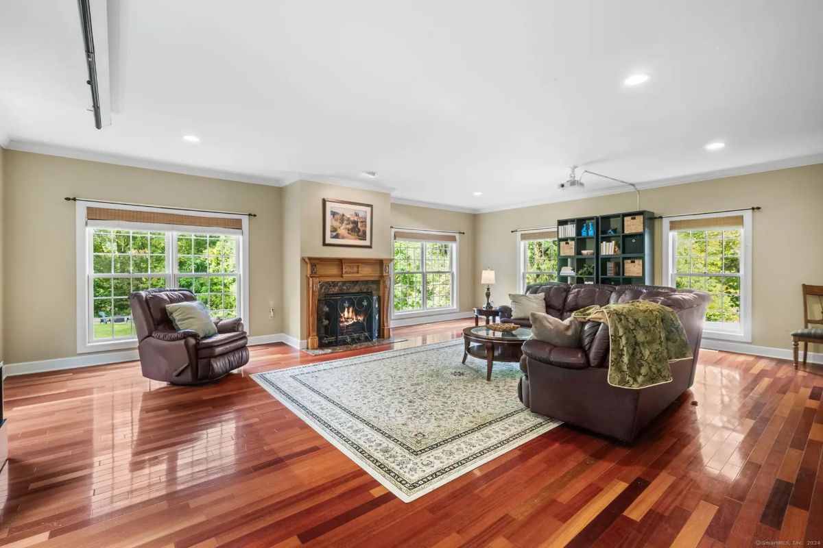 Cozy living room featuring a classic fireplace.