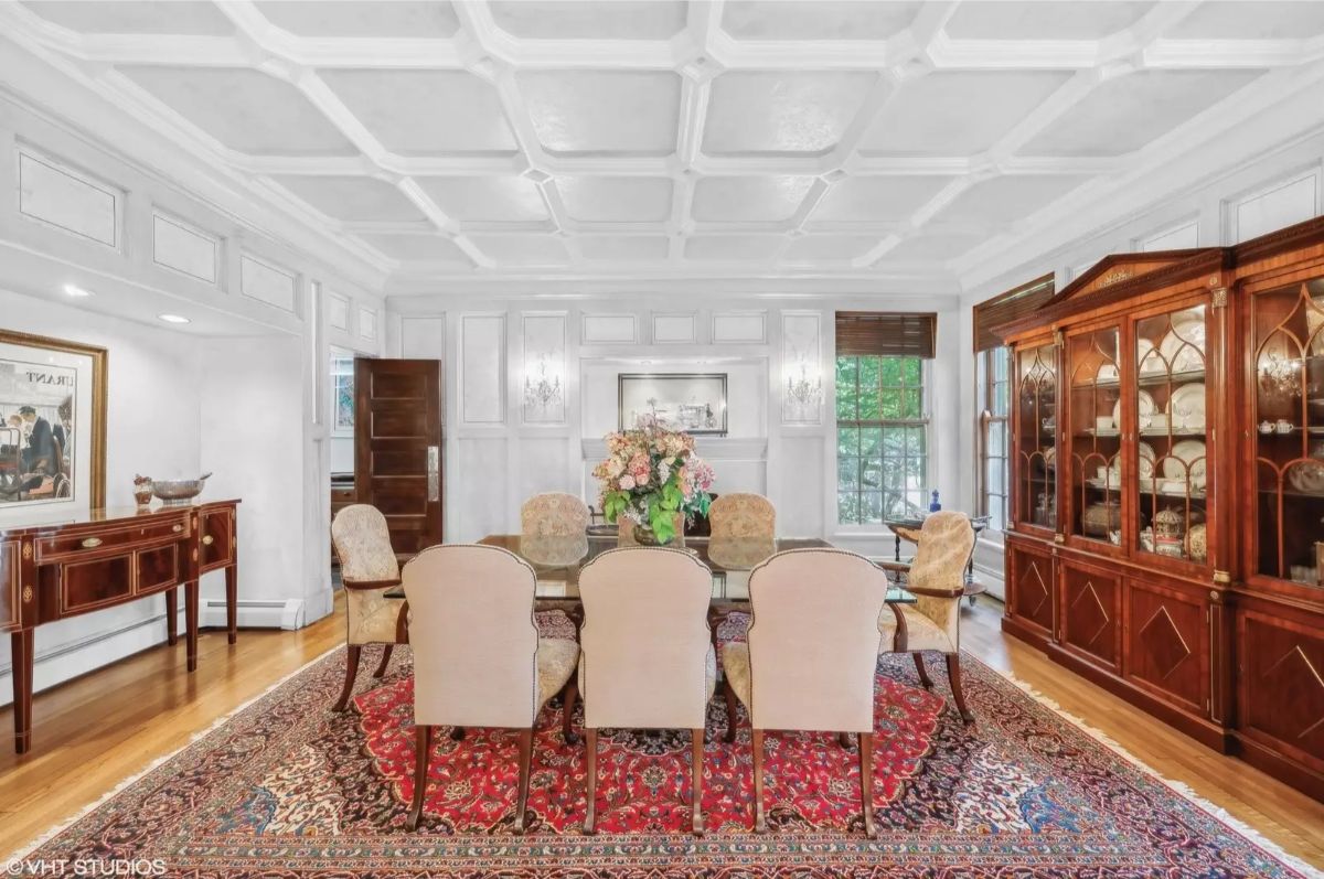 A coffered ceiling adds architectural elegance to the dining space.