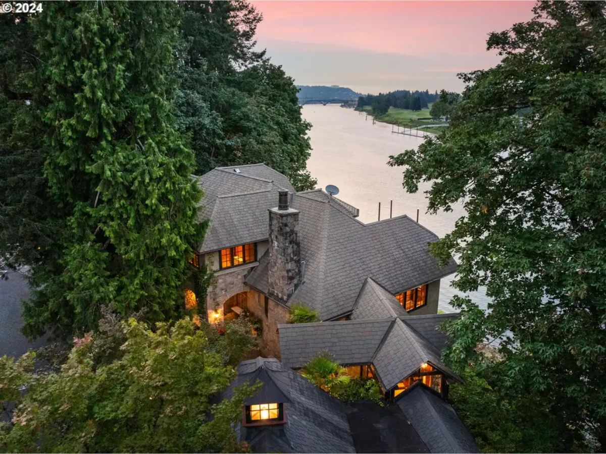 Located along the Willamette River with approximately 100 feet of river frontage, this estate offers scenic views of the river, Waverly Golf Course, and glimpses of Mt. Hood.