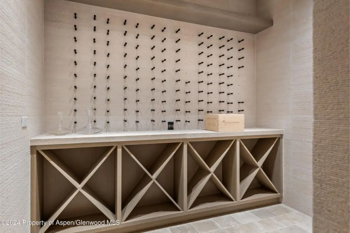 Custom wall-mounted racks for bottle display and easy access.