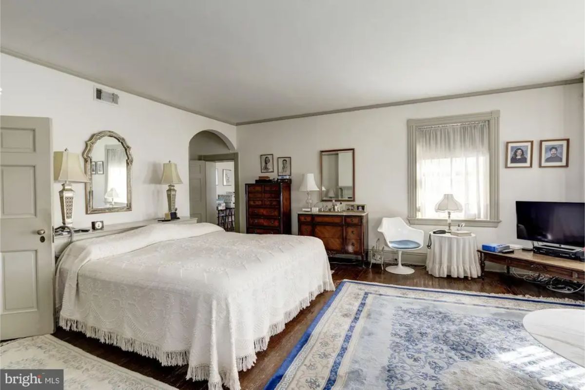 Large primary bedroom with a neutral color palette and abundant natural light.