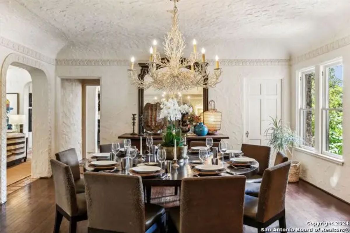 Dining room with a round table surrounded by upholstered chairs for an intimate setting.