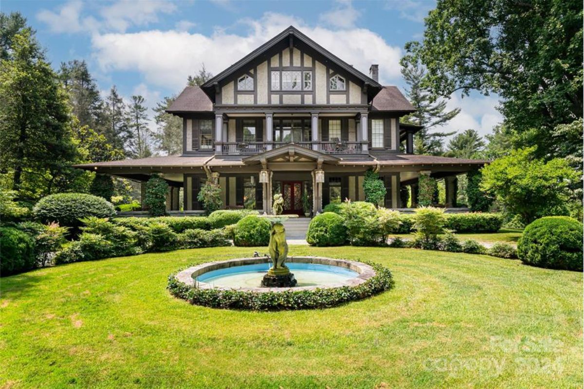 Built in 1855 and redesigned by Richard Sharp Smith in 1903, this 9-bedroom, 10 full and 2 partial bathroom Tudor Revival home in Hendersonville blends historic charm with modern amenities.