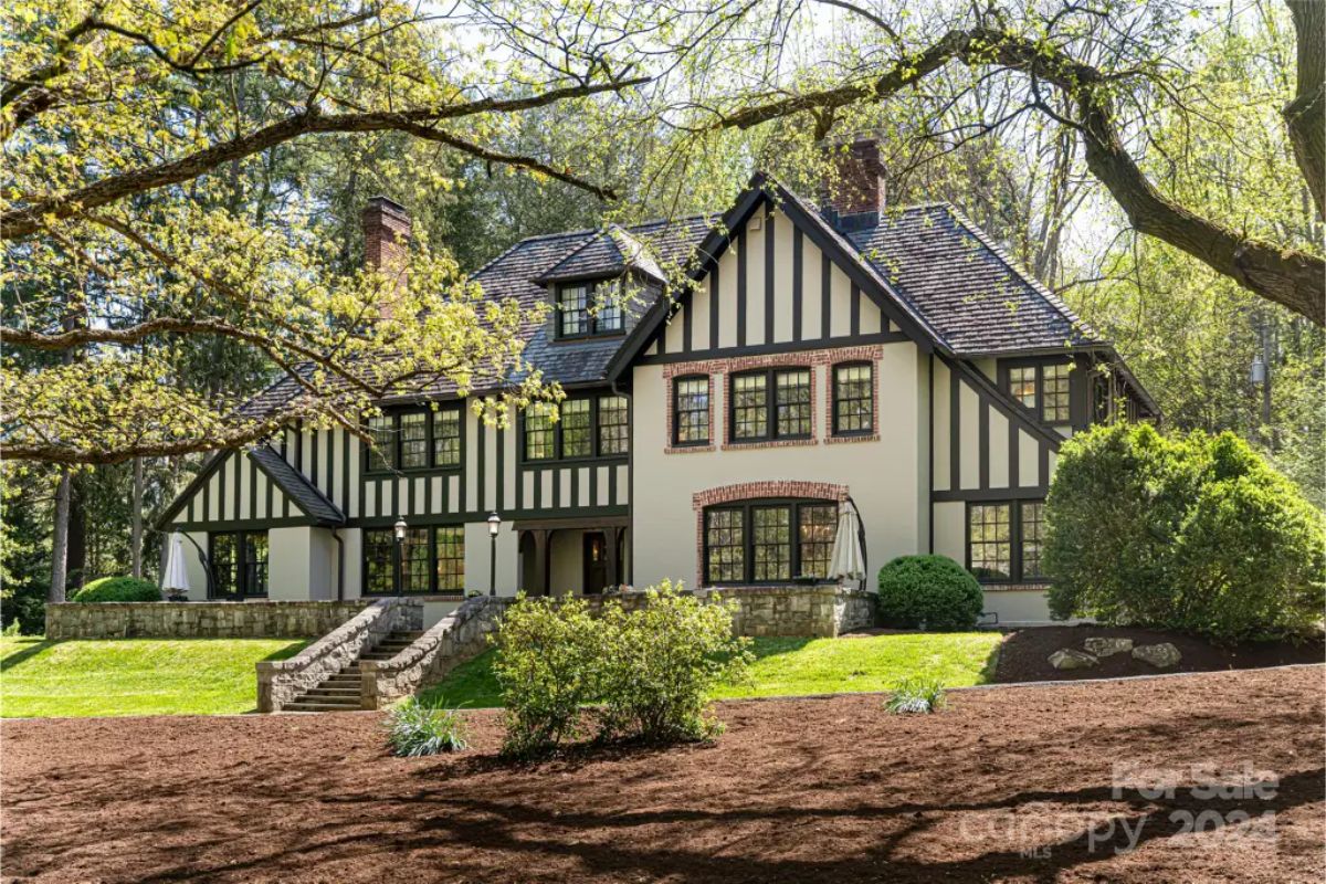 Set within the historic Biltmore Forest, this 1925 Tudor estate offers 5 bedrooms, 7 bathrooms, and 4,568 square feet of living space.