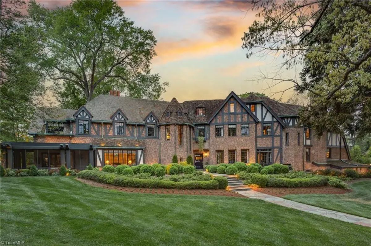 Built in 1929 by architect Charles Hartmann, the Julian Price House is a Tudor-style residence with Greek Revival influences situated on 1.6 acres in Fisher Park.