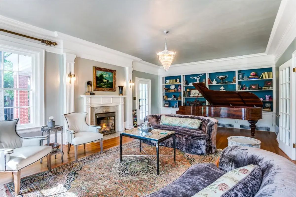 Large windows and a classic fireplace at the center.